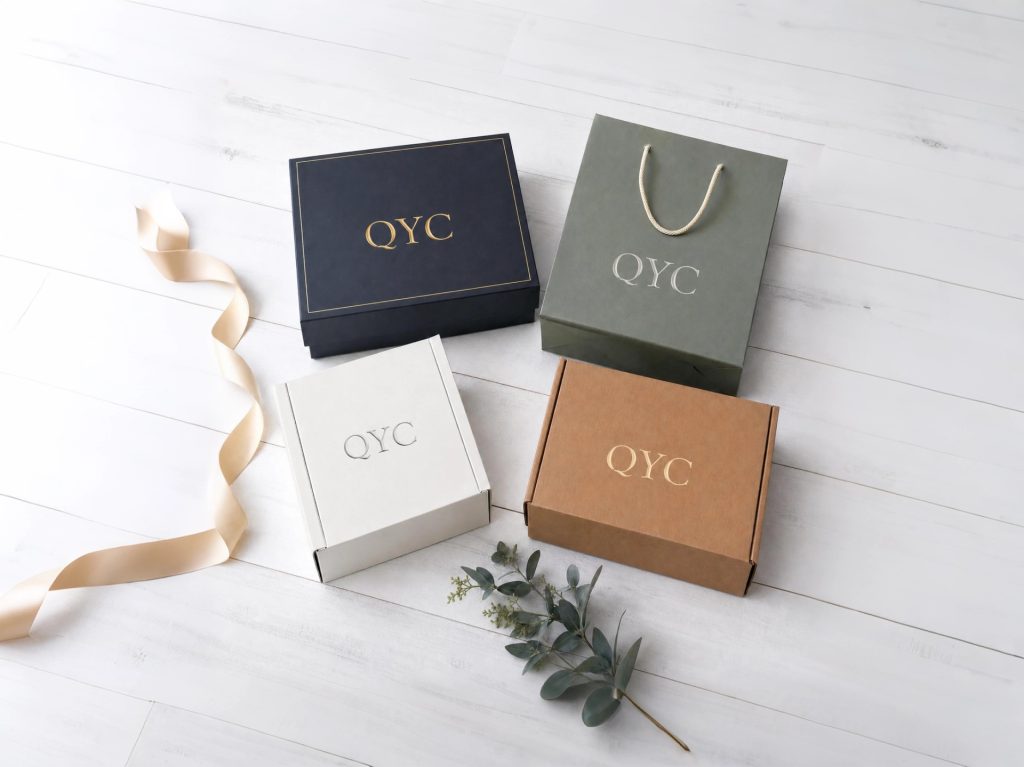 QYC Print custom packaging portfolio displaying rigid boxes, folding boxes, paper bags, and single-bottle packaging.