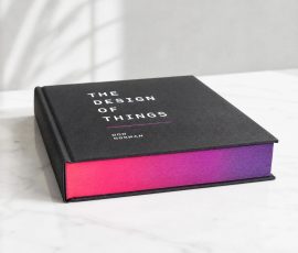 Modern hardcover book with vibrant pink and purple gradient sprayed edges sample.