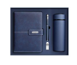 Corporate gift notebook set with custom QYC logo, leather cover, and premium packaging box.