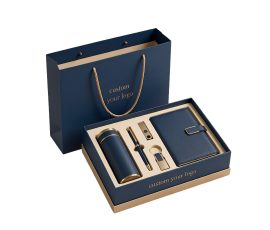 Corporate gift notebook set with custom QYC logo, leather cover, and premium packaging box.