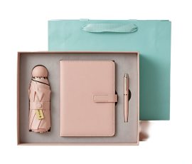 Corporate gift notebook set with custom QYC logo, leather cover, and premium packaging box.