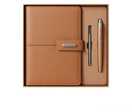 Corporate gift notebook set with custom QYC logo, leather cover, and premium packaging box.