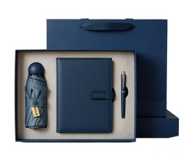 Corporate gift notebook set with custom QYC logo, leather cover, and premium packaging box.