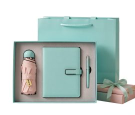 Corporate gift notebook set with custom QYC logo, leather cover, and premium packaging box.