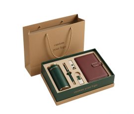 Corporate gift notebook set with custom QYC logo, leather cover, and premium packaging box.