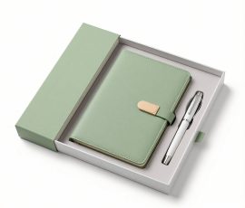 Corporate gift notebook set with custom QYC logo, leather cover, and premium packaging box.