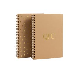 Custom eco-friendly recycled paper notebook with gold foil stamped QYC logo and YO wire binding.
